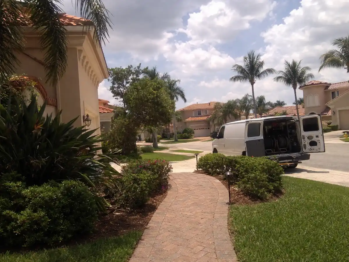 Service van arriving on a Cape Coral, FL street — local same-day coverage